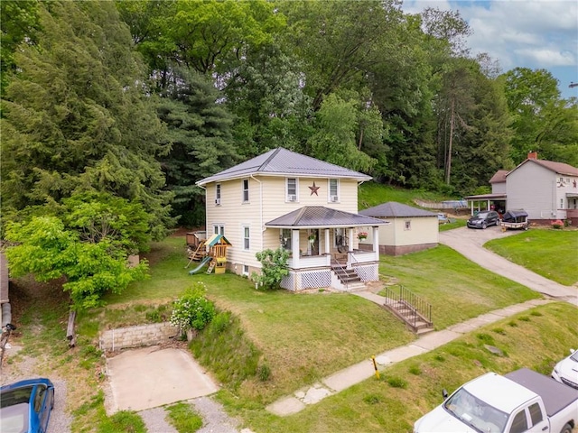 122 W Main St, Worthington, PA 16262 - view of front of house with a porch, metal roof, and a front yard