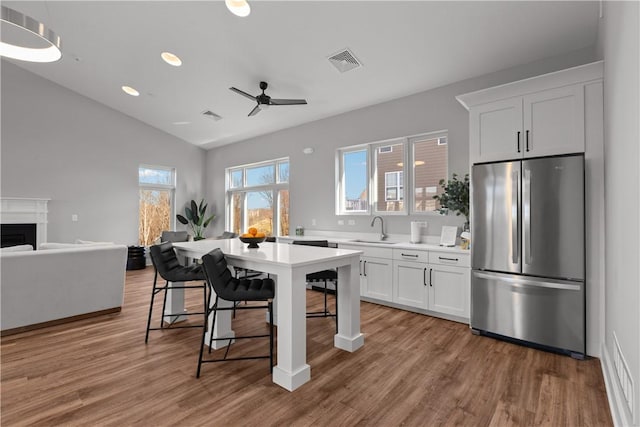 9002 Hickory Rd, Pine Twp Nal, PA 15044 - kitchen with freestanding refrigerator, a sink, light countertops, a ceiling fan, and vaulted ceiling
