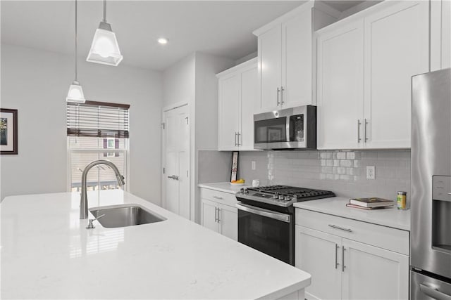 9002 Hickory Rd, Pine Twp Nal, PA 15044 - kitchen featuring appliances with stainless steel finishes, a sink, decorative backsplash, light countertops, and white cabinetry