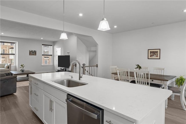 9002 Hickory Rd, Pine Twp Nal, PA 15044 - kitchen featuring stainless steel dishwasher, a sink, open floor plan, dark wood finished floors, and an island with sink