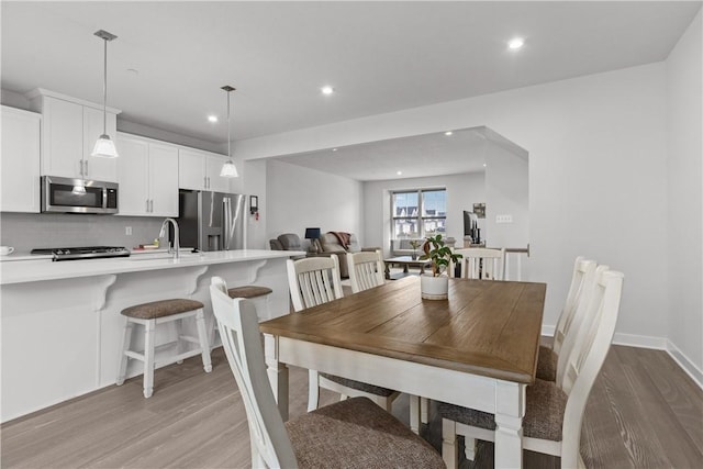 9002 Hickory Rd, Pine Twp Nal, PA 15044 - dining area featuring light wood finished floors, recessed lighting, and baseboards