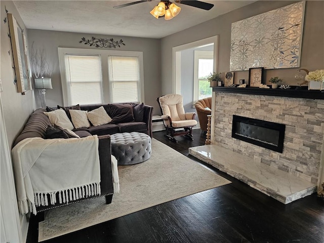 3213 Brownsville Rd, Brentwood, PA 15227 - living room with ceiling fan, wood finished floors, and a stone fireplace