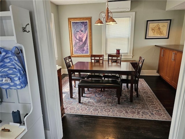 3213 Brownsville Rd, Brentwood, PA 15227 - dining area featuring dark wood-style floors, a wall unit AC, and baseboards