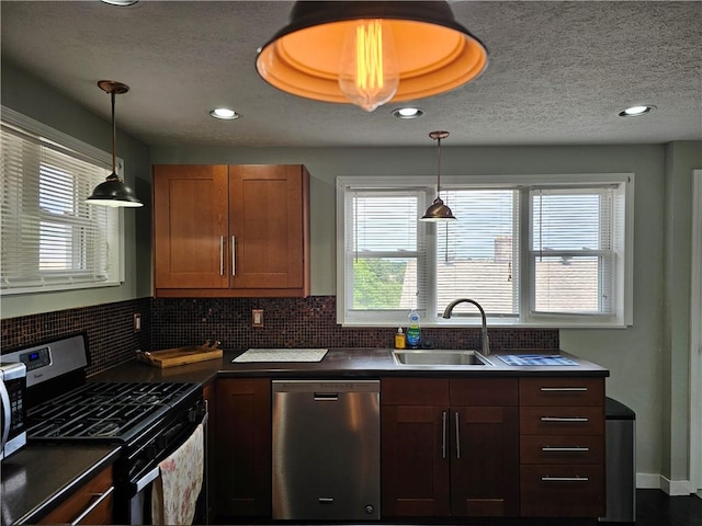 3213 Brownsville Rd, Brentwood, PA 15227 - kitchen with stainless steel appliances, dark countertops, tasteful backsplash, healthy amount of natural light, and a textured ceiling
