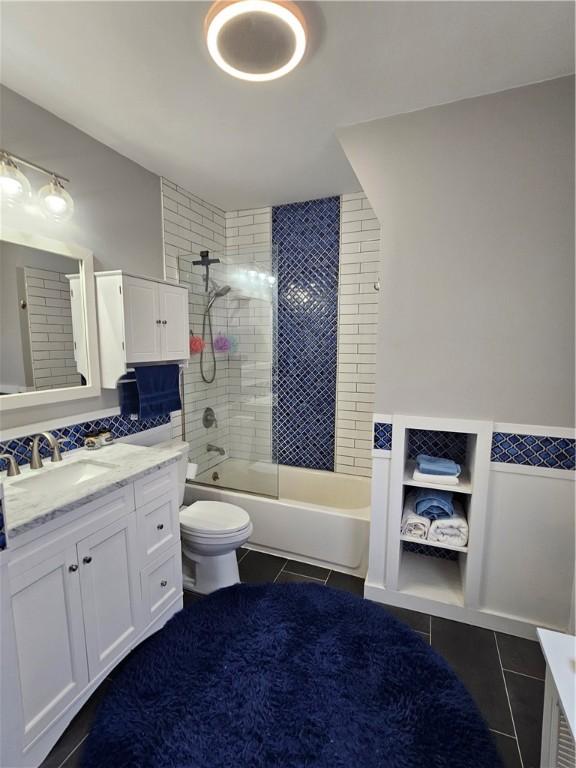 3213 Brownsville Rd, Brentwood, PA 15227 - full bathroom with tile patterned floors, vanity, toilet, and shower / bath combination