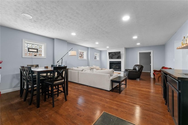1904 E National Pike, North Bethlehem, PA 15360 - dining area featuring a textured ceiling, wood finished floors, recessed lighting, a fireplace, and baseboards