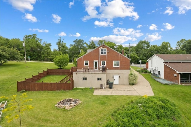 1904 E National Pike, North Bethlehem, PA 15360 - rear view of house featuring a patio, an outdoor fire pit, a lawn, and stairs