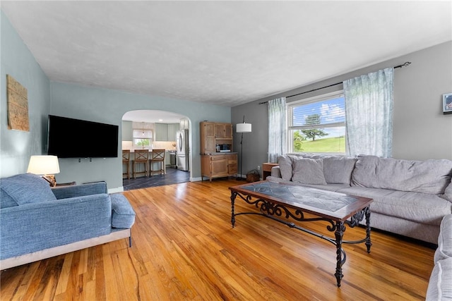 1904 E National Pike, North Bethlehem, PA 15360 - living area with arched walkways, light wood finished floors, and baseboards