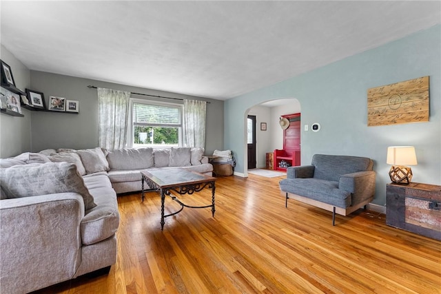 1904 E National Pike, North Bethlehem, PA 15360 - living room with arched walkways and light wood-style floors