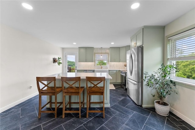 1904 E National Pike, North Bethlehem, PA 15360 - kitchen with appliances with stainless steel finishes, light countertops, a center island, a breakfast bar area, and a sink