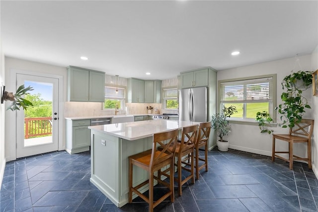 1904 E National Pike, North Bethlehem, PA 15360 - kitchen featuring healthy amount of natural light, stone tile floors, light countertops, a center island, and recessed lighting