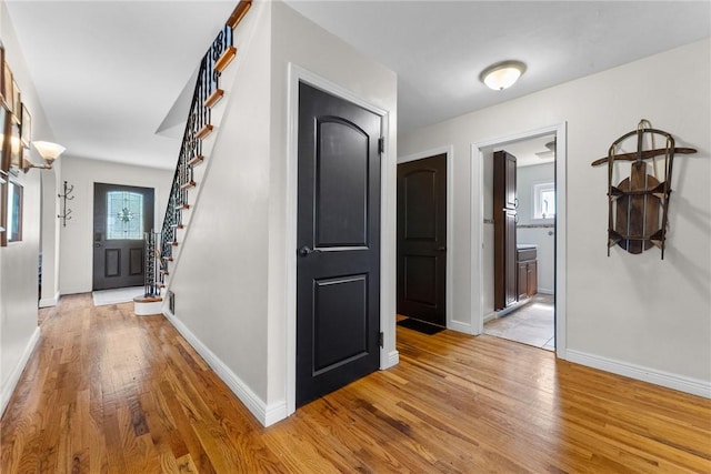 1904 E National Pike, North Bethlehem, PA 15360 - hall with light wood finished floors, stairs, baseboards, and healthy amount of natural light