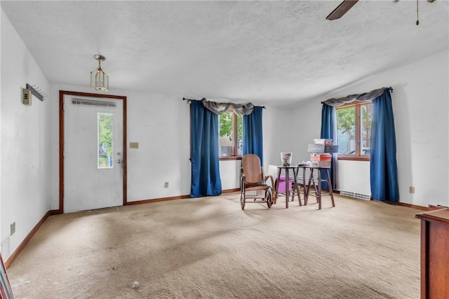408 Mitchell Ave, City Of But Nw, PA 16001 - living area with plenty of natural light, a ceiling fan, carpet, baseboards, and a textured ceiling