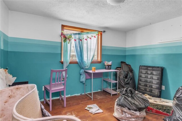 408 Mitchell Ave, City Of But Nw, PA 16001 - bedroom featuring a textured ceiling and wood finished floors