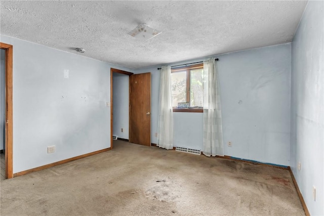 408 Mitchell Ave, City Of But Nw, PA 16001 - unfurnished room with a textured ceiling, carpet flooring, and baseboards