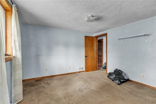 408 Mitchell Ave, City Of But Nw, PA 16001 - unfurnished bedroom with carpet floors, baseboards, and a textured ceiling