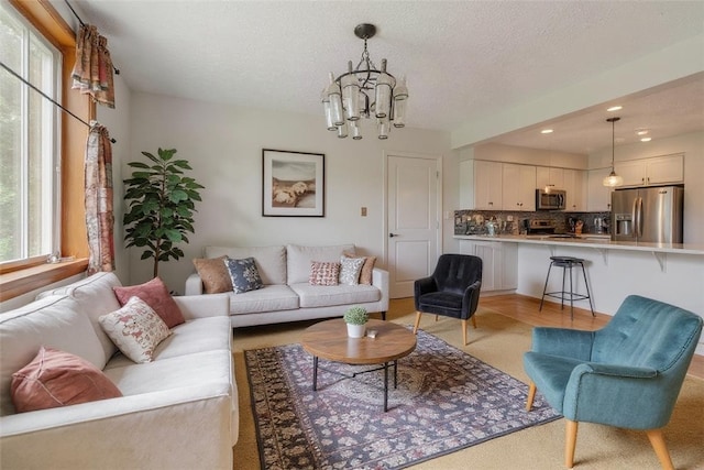 408 Mitchell Ave, City Of But Nw, PA 16001 - living room featuring light carpet, a chandelier, recessed lighting, and a textured ceiling