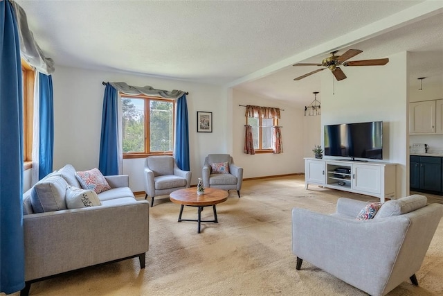 408 Mitchell Ave, City Of But Nw, PA 16001 - living area featuring ceiling fan, light carpet, a textured ceiling, and beamed ceiling