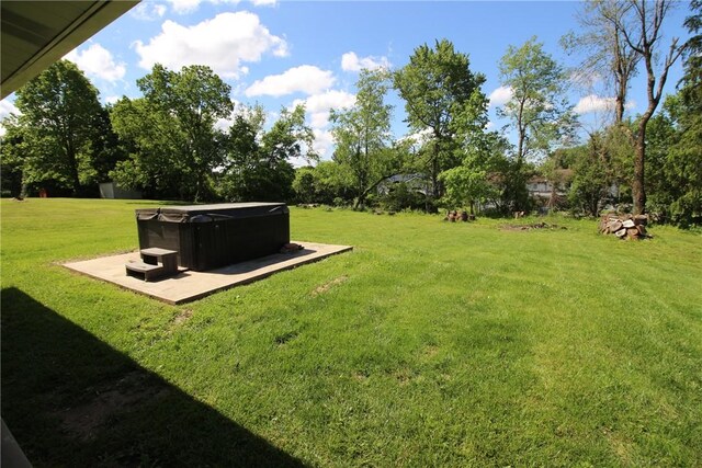2224 Park Ave, Manor Twp, PA 16226 - view of grassy yard featuring a hot tub, a patio, and view of scattered trees
