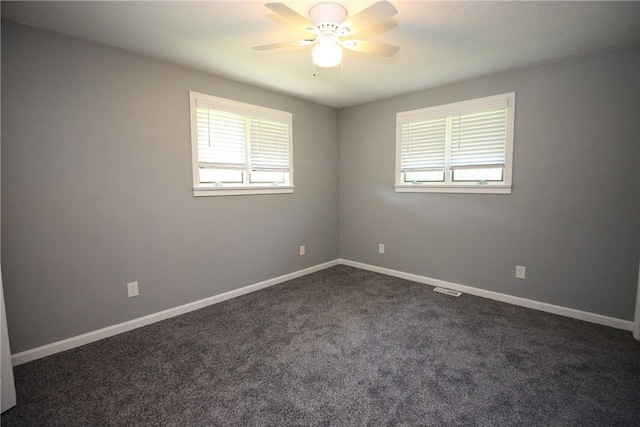 2224 Park Ave, Manor Twp, PA 16226 - spare room featuring healthy amount of natural light, a ceiling fan, dark carpet, and baseboards