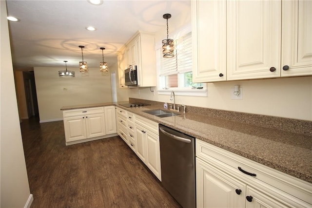 2224 Park Ave, Manor Twp, PA 16226 - kitchen featuring stainless steel appliances, a sink, dark wood finished floors, a peninsula, and stone countertops