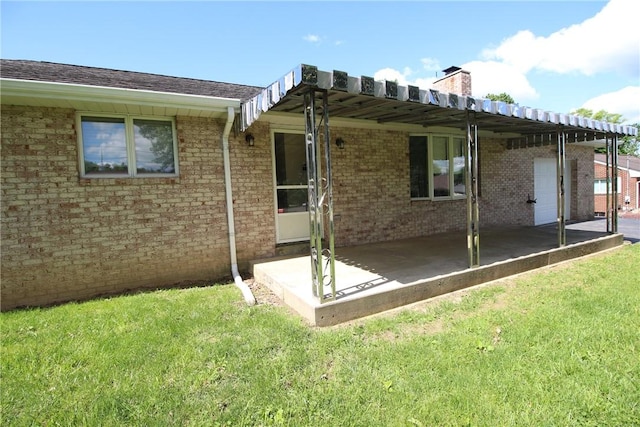 2224 Park Ave, Manor Twp, PA 16226 - back of house featuring a patio area, a lawn, a chimney, and brick siding