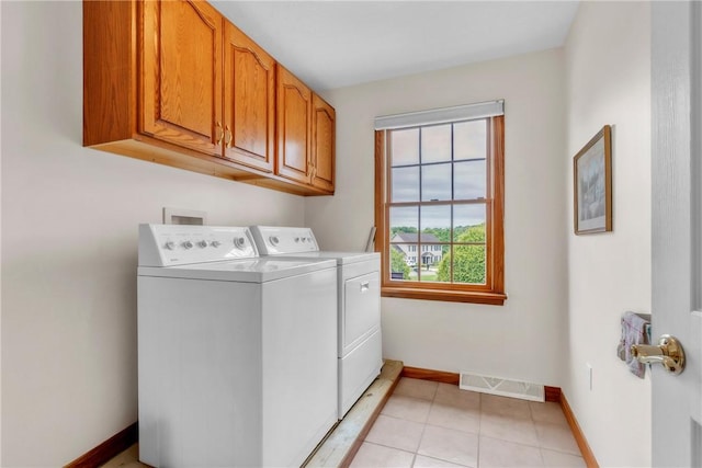 113 Sunburst Ct, Center Twp But, PA 16001 - washroom featuring independent washer and dryer, cabinet space, baseboards, and light tile patterned floors