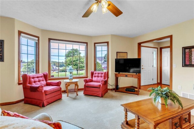 113 Sunburst Ct, Center Twp But, PA 16001 - carpeted living room featuring baseboards and ceiling fan