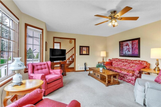 113 Sunburst Ct, Center Twp But, PA 16001 - carpeted living room featuring healthy amount of natural light, a ceiling fan, baseboards, and stairway