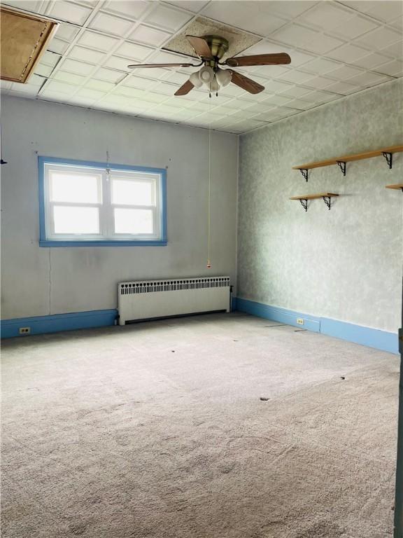 192 W Lincoln St, Waynsbrg/Frankln Twp, PA 15370 - empty room with radiator, ceiling fan, carpet floors, and attic access