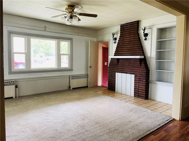 192 W Lincoln St, Waynsbrg/Frankln Twp, PA 15370 - unfurnished living room with radiator heating unit, ceiling fan, stairs, and built in shelves