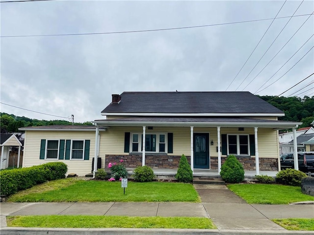 192 W Lincoln St, Waynsbrg/Frankln Twp, PA 15370 - view of front of property with stone siding, covered porch, and a front yard