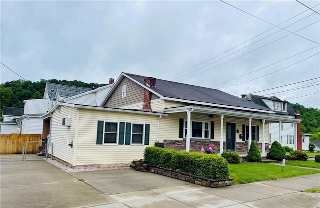 192 W Lincoln St, Waynsbrg/Frankln Twp, PA 15370 - view of front of property with covered porch and a chimney