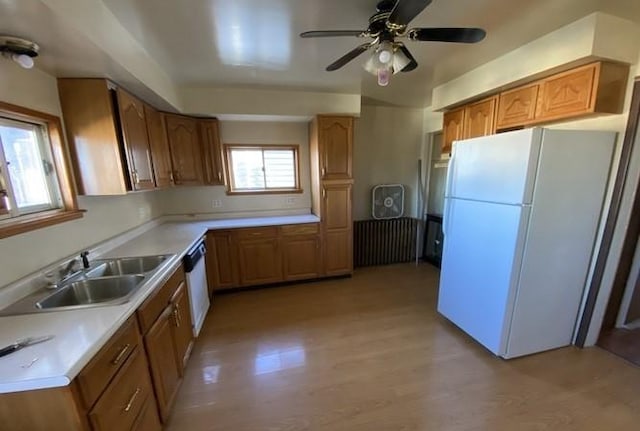 314 Lowell Unit 1/2, Vandergrift Wml, PA 15690 - kitchen featuring freestanding refrigerator, a sink, light wood-type flooring, ceiling fan, and light countertops