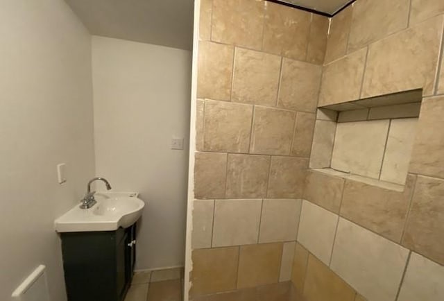 314 Lowell Unit 1/2, Vandergrift Wml, PA 15690 - bathroom featuring vanity, a tile shower, and tile patterned floors