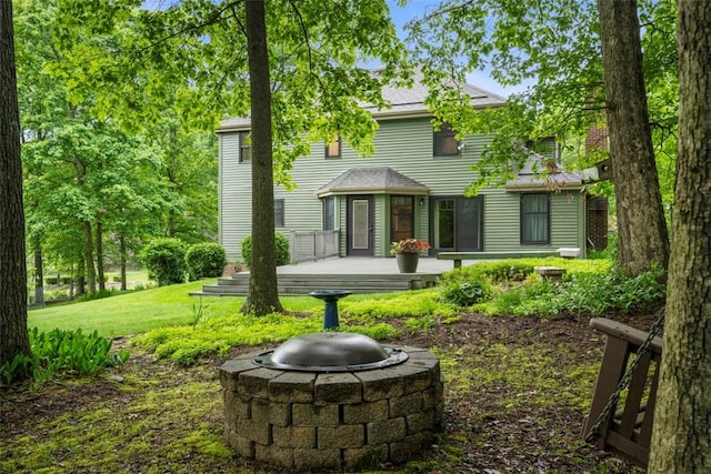 100 Firethorn Rd, Economy, PA 15005 - back of property with a wooden deck, a lawn, and a fire pit