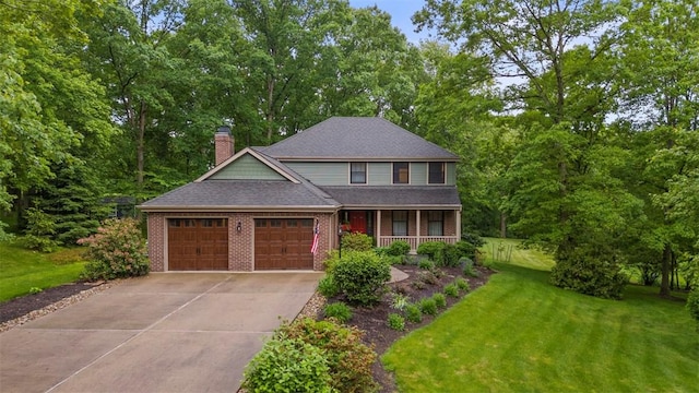 100 Firethorn Rd, Economy, PA 15005 - view of front of house with an attached garage, a porch, a front lawn, driveway, and brick siding