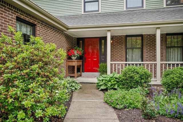 100 Firethorn Rd, Economy, PA 15005 - view of exterior entry with brick siding, roof with shingles, and a porch