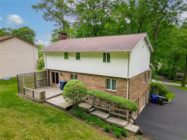454 Cherokee Dr, Center Twp But, PA 16001 - back of property featuring a deck, a chimney, a garage, and brick siding