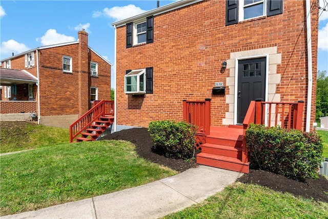 6225 Smithfield St, Elizabeth Twp/Boro, PA 15135 - view of front facade with a front lawn and brick siding