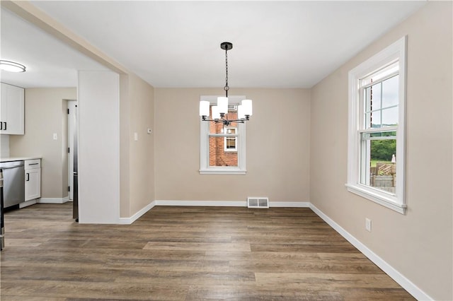 6225 Smithfield St, Elizabeth Twp/Boro, PA 15135 - unfurnished dining area featuring a chandelier, baseboards, and wood finished floors