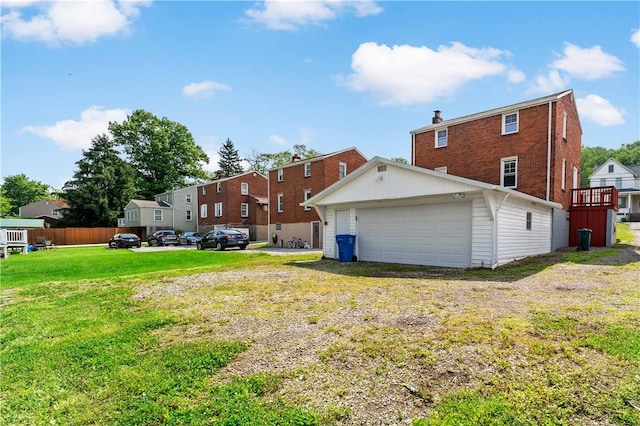 6225 Smithfield St, Elizabeth Twp/Boro, PA 15135 - rear view of property with a garage and a lawn