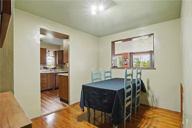 1406 Mccully Rd, Castle Shannon, PA 15234 - dining room featuring light wood-style floors and healthy amount of natural light