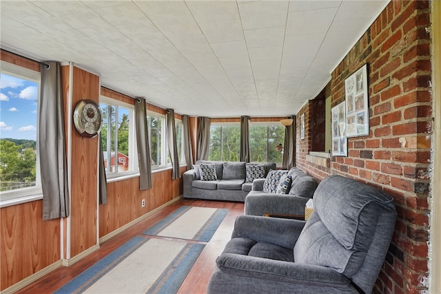 1406 Mccully Rd, Castle Shannon, PA 15234 - sunroom / solarium with hardwood / wood-style floors, healthy amount of natural light, wood walls, and baseboards