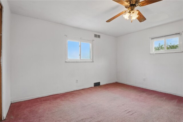1406 Mccully Rd, Castle Shannon, PA 15234 - carpeted empty room featuring plenty of natural light, baseboards, and ceiling fan
