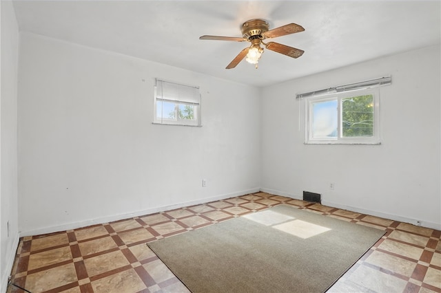 1406 Mccully Rd, Castle Shannon, PA 15234 - spare room with healthy amount of natural light, ceiling fan, baseboards, and inlaid floor details