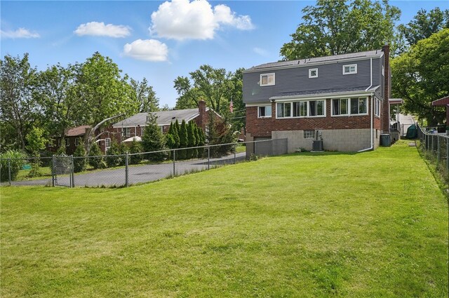 1406 Mccully Rd, Castle Shannon, PA 15234 - rear view of property with brick siding, central AC unit, and a chimney