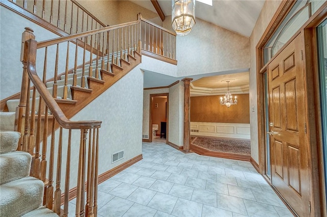 23 Pintail Dr, Indiana Twp Nal, PA 15238 - stairs with a chandelier, high vaulted ceiling, crown molding, baseboards, and wainscoting