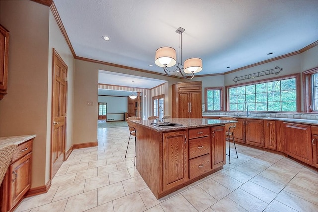 23 Pintail Dr, Indiana Twp Nal, PA 15238 - kitchen with brown cabinets, a kitchen breakfast bar, ornamental molding, a sink, and a center island