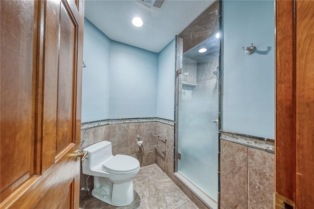 23 Pintail Dr, Indiana Twp Nal, PA 15238 - bathroom featuring a stall shower, tile walls, toilet, wainscoting, and tile patterned flooring